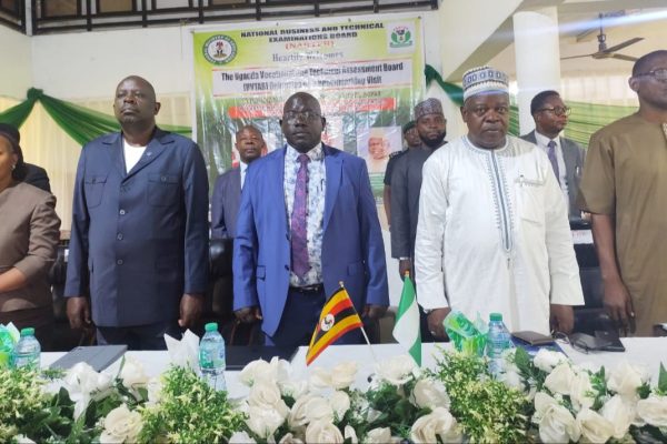 Representative of the Hon. Minister of Education, Mr. Kolawole Osundeyi (2nd right); Registrar/Chief Executive Officer, National Business and Technical Examinations Board (NABTEB), Dr. Mohammed Aminu Mohammed (2nd left); Board Member and Team Lead of the Uganda Vocational and Technical Assessment Board (UVTAB) delegation on Benchmarking Visit to NABTEB, Engr. Albert Akovuku (left); and Director, Examinations Administration, NABTEB, Ms. Chigoziem Susan Metu during the recitation of the national anthems of both Nigeria and Uganda at the opening ceremony of the Benchmarking exercise on Monday, 20th April, 2026, at NABTEB national headquarters in Benin City, Nigeria