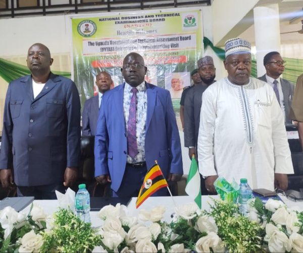 Representative of the Hon. Minister of Education, Mr. Kolawole Osundeyi (2nd right); Registrar/Chief Executive Officer, National Business and Technical Examinations Board (NABTEB), Dr. Mohammed Aminu Mohammed (2nd left); Board Member and Team Lead of the Uganda Vocational and Technical Assessment Board (UVTAB) delegation on Benchmarking Visit to NABTEB, Engr. Albert Akovuku (left); and Director, Examinations Administration, NABTEB, Ms. Chigoziem Susan Metu during the recitation of the national anthems of both Nigeria and Uganda at the opening ceremony of the Benchmarking exercise on Monday, 20th April, 2026, at NABTEB national headquarters in Benin City, Nigeria